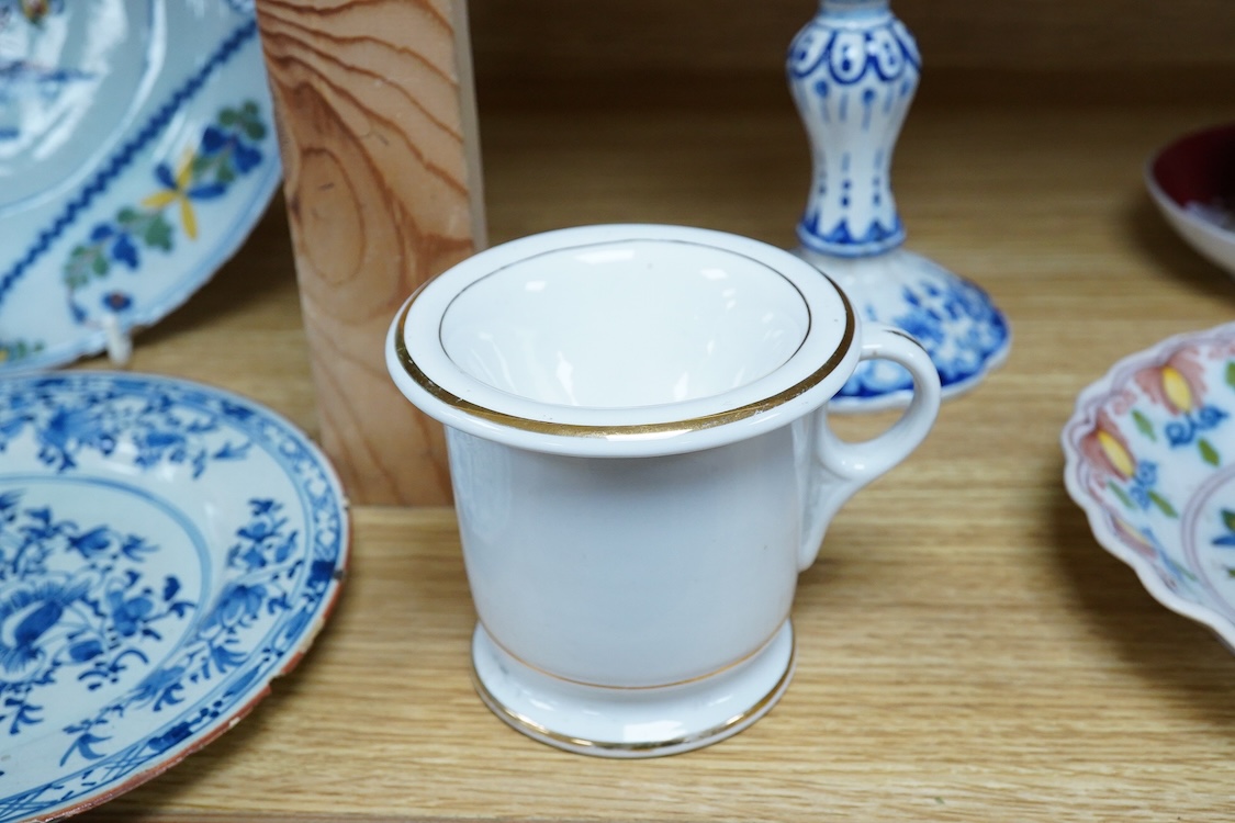 An 18th century Delft plate, two tin-glazed dishes and candlestick, a Gardener Russian porcelain tea cup and saucer, and a mug with liner, largest 22cm in diameter